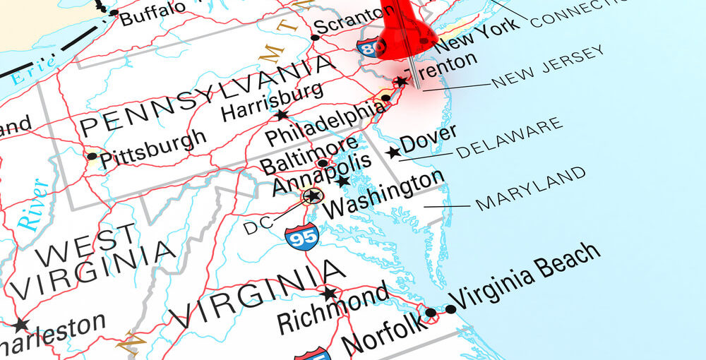Red Thumbtack Over New Jersey State USA Map