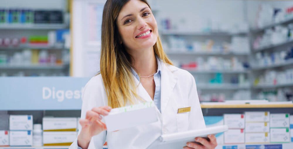 Smiling Female Pharmacy Technician working in a chemist